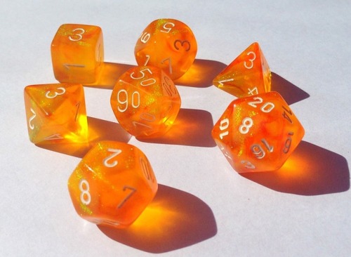 battlecrazed-axe-mage:I found one of my holy grails–a full polyhedral set of orange borealis!!These 