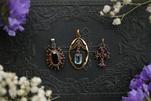 Beautiful old and antique genuine silver pendants with blue topaz and garnets are available at my Et
