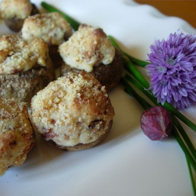 Stuffing cream cheese, Parmesan cheese, and bacon into mushrooms is a delicious way to impress someo