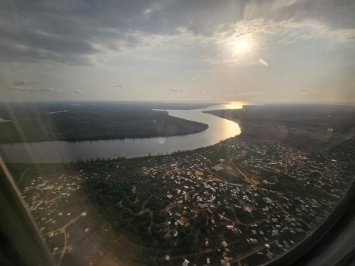 The Backwater Lagoons Of Cameroon, Africa, The Reflection Of The Sun And Hundreds Of Tin-roof Huts.