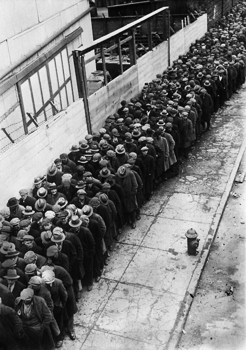 Men waiting in line for an opportunity at a job during the Depression, 1930