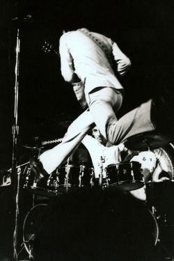 soundsof71:  The Who’s Pete Townshend flying, with Keith Moon, uhm, between his legs, Saratoga Springs, NY on August 2, 1971 — introducing Who’s Next,which would be released 12 days later. Photo by Peter J. Corrigan. 