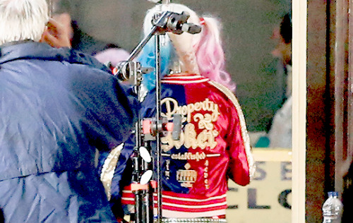 movienetworkpr:  Hey Puddin’s! Check out Margot Robbie on set in Toronto for Suicide Squad!Tidbits: Her shirt says “Daddy’s Lil Monster”, the back of her jacket says “Property of Joker” and one of Harley’s weapons, her bat, says “Good