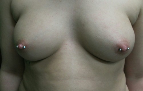 XXX piercing-j:  Fresh freehand female nipple photo