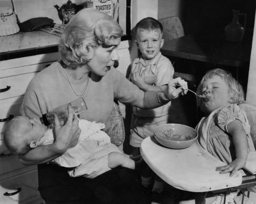 Happy Mother’s Day!
“It looks like Mother’s Day will be much like any other day for Mrs. Sherry Raser, 25, of North Hollywood, as she carefully balances 2-month-old Christopher in one arm while attempting to feed last spoonful of breakfast to Kerry,...