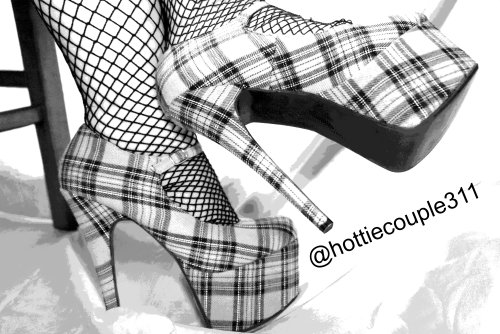 hottiecouple311:  Some more sexy B&amp;W foot and heel fetish photos from my Goddess Wife. I love the contrast of plaid and fishnets in black and white.