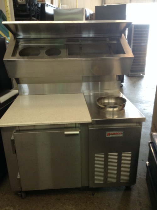 northeastequipment:
“ Used Marsal 48″ pizza prep unit with a 30″x30″ Quartz work top, a refrigerated top well, sauce well, and single door under cabinet. It can hold 2 full hotel pans up to 6″ deep in the top well. Inserts for the top well are...