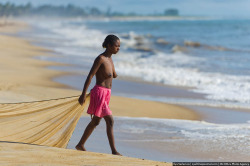 Topless Madagascan Girl Fishing.