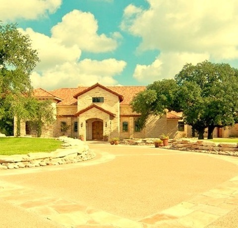 Mediterranean LandscapeInspiration For A Sizable Front Yard With Stone Landscaping In The Mediterranean