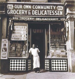 Porn photo atomicrobotlive:Harlem grocer standing in