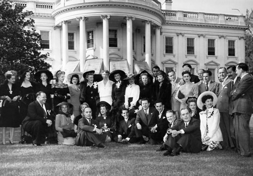 Eleanor Roosevelt (left center, in white) on the south lawn of the White House with film celebrities