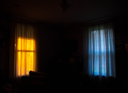 sylvanna:  The light from the sunset only shines through the left window in my room, leaving the other untouched. Happy I get to see this every evening. November 2014 