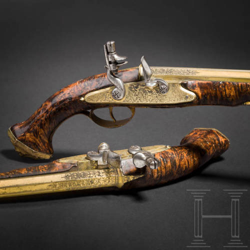 A pair of brass barreled flintlock pistol crafted by Felix Werder of Zurich, Switzerland, circa 1660