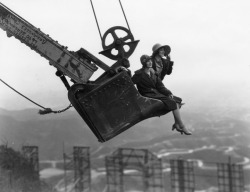 losangelespast:  Two fashionably dressed women look out over Hollywoodland and its iconic sign from the vantage point of a raised steam shovel bucket, 1924.  