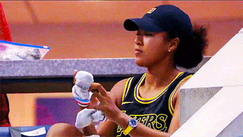 striveforgreatnessss: NAOMI OSAKA in the stands wearing a Kobe jersey after advancing to the US Open