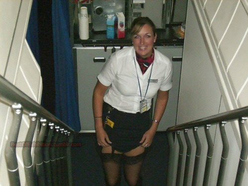 bestofexhibition: Stewardess showing her stockings in the plane!