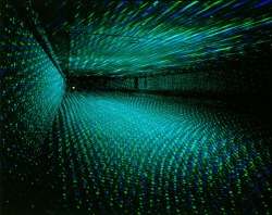 absolvd:  Rainer Plum  Laser installation “In Praise of Shadows&quot; Argon laser scanning system Cologne, Deutz Bridge, 1998