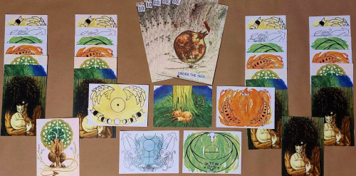 A wide variety of brightly coloured postcards and printed minicomics on display.