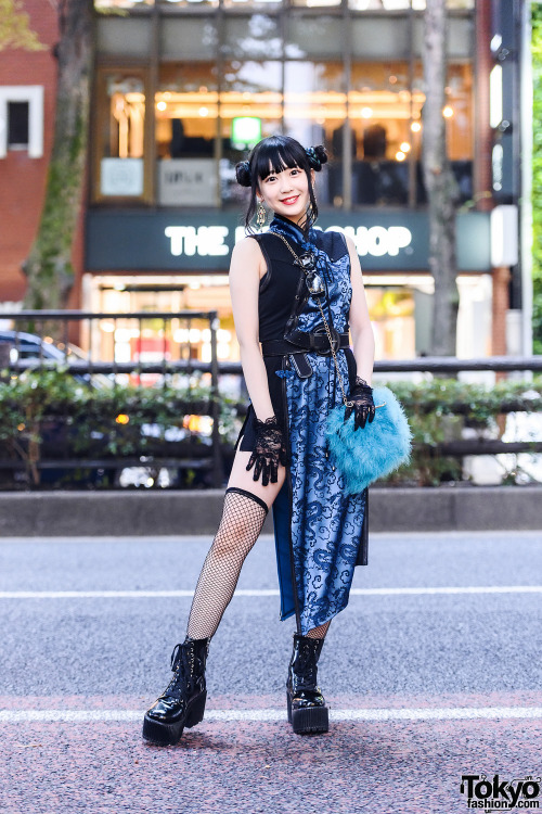 Harajuku shop staffer Misuru on the street wearing a twin buns hairstyle, black lace gloves, a Qutie