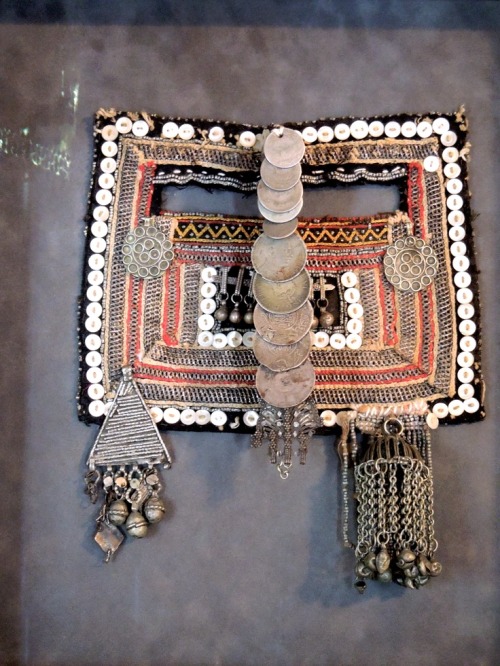 Saudi Arabian mask and  traditional headdress with jewelry from  Mansoojat Foundation’s (Museu