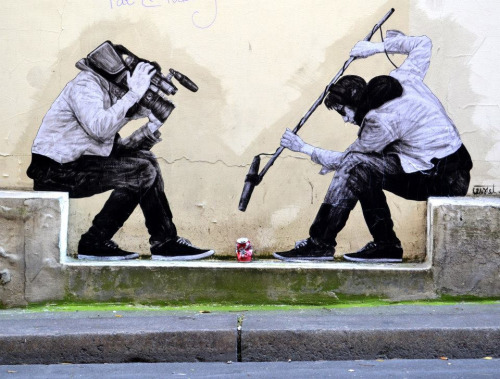 itsderandom:The French street artist known as Levalet, aka Charles Leval, works in Paris filling con