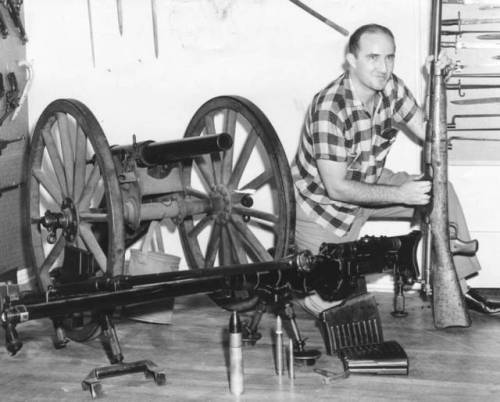 Burbank, California, 1959: ”Si Witkin, Burbank gun collector, cleans a WWI German anti-tank rifle. T