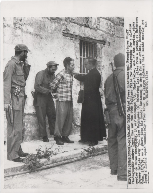 “Former Batista Army Jose Rodriguez Receives Last Rites From a Priest at Matanzas, Cuba” by Andrew L