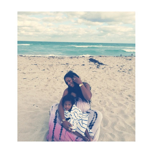 Yandy and her little one hit the beach.