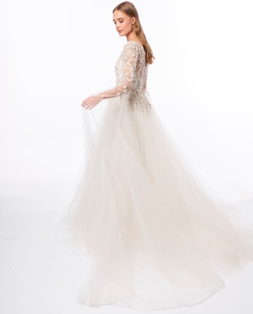 This dreamy Jenny Packham wedding dress is adorned with sparkly floral embellishments on the bodice 