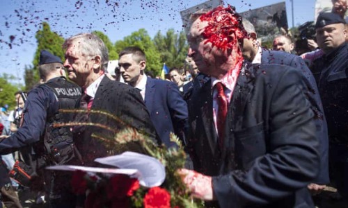 Russian ambassador to Poland pelted with red paint at VE Day gathering | Poland | The GuardianRussia