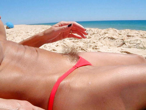 skycladvenus: She would attract far fewer staring eyes at the beach if she shaved her snatch. But wh