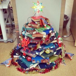 nprbooks:  smithsonianlibraries:  Our staff in the library at the Smithsonian’s National Museum of Natural History just put the finishing touches on their book tree! Not quite as impressive as some library’s NUC trees, but you work with what you have