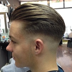 vintagebarbershop:  @barbertownworcs Blow dryed back .. Low real tight razor fade .. And finished with @uppercutdeluxe .. Tight !! .Read more at http://web.stagram.com/p/726835690193405116_270460880#5YWoU5vUxFhSbkVs.99