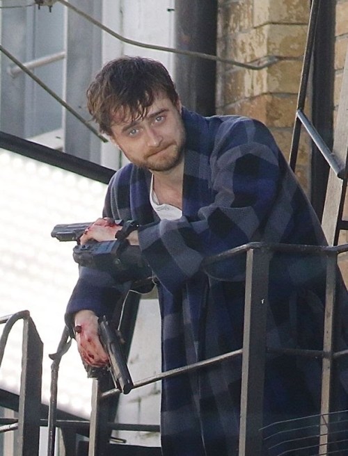 titillatingtubist:spoookiepie:ruinedchildhood:Daniel Radcliffe on set of Guns AkimboWe live in such a strange reality th