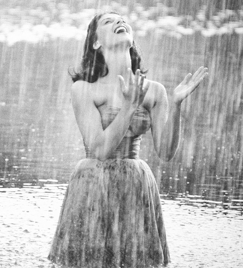 missavagardner:   Pier Angeli, 22, clad in strapless chiffon party dress, exhulting in a downpour of