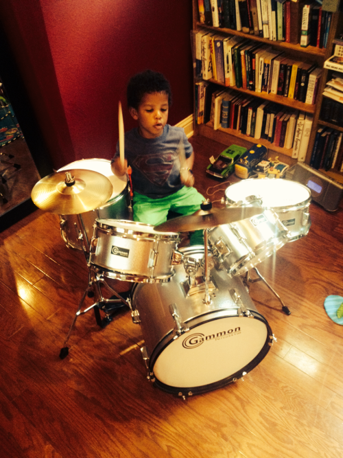 My little drummer boy got his 1st set of drums today! 