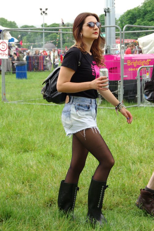 Boots, black pantyhose and short denim skirt for this sexy woman.Woman in pantyhose