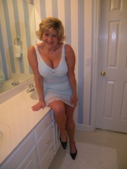 naughty-aunt:  I stepped into the bathroom by accident as aunt Bonnie was changing.  I paused, embarrassed, apologizing.  She said it was ok, comforting me. My eyes glued to her delicious cleavage, admiring her curves.  I told her she looked so sexy. 