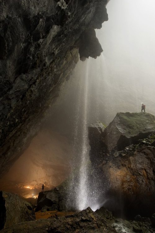 archatlas:    Hang Son Doong Carsten PeterLike a castle on a knoll, a rock formation shines beneath a skylight in Hang Son Doong. A storm had just filled the pool, signaling that exploring season was coming to an end. [via]