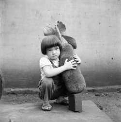 poetryconcrete:  Boy with a jackfruit, photo by Haruo Ohara, c.1950, at Arara Ranch, in Brazil.