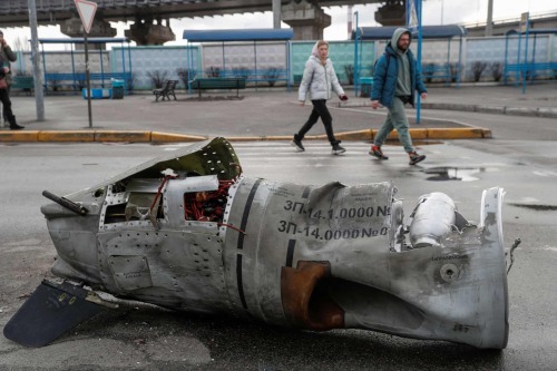 Pedestrians pass the remains of a missile at a bus terminal, Kyiv, Ukraine, Valentyn Ogirenko, 2022