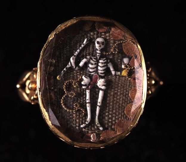 aleyma:  Mourning ring with a skeleton holding an hourglass on a background of woven