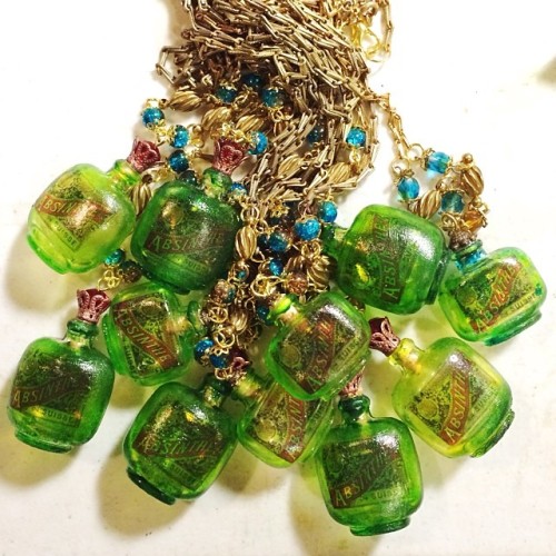 Made a pile if Absinthe necklaces! Available in my shop #asunder #absinthe #bottlejewelry #minibottl