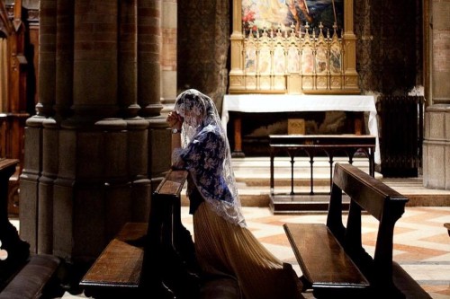 globalchristendom: A woman prays at the Church of the Sacred Heart of Suffrage in Rome, Italy. (Cred