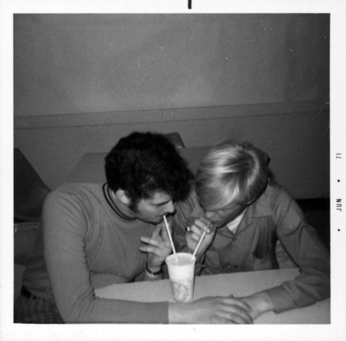 emigrejukebox:Gay couple, possibly students from the University of Rochester, sip from the same drin