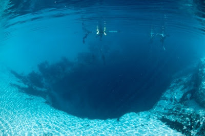 sixpenceee: The Great Blue Hole is an underwater sinkhole off the coast of Belize.