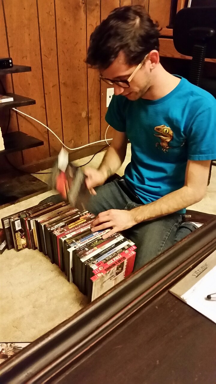 Parker is alphabetizing his favorite DVDs, in subgroups and by director.   I live