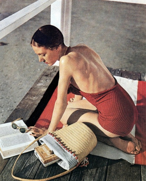 Leslie Dickson reading while wearing a bathing suit by Hermès. Photo by Louise Dahl-Wolfe, Useppa Is