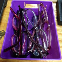 A container of lost glasses in the office