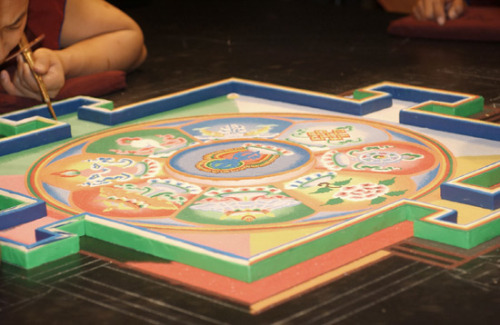 freersackler:  In response to the September 11 tragedies, twenty Buddhist monks from the Drepung Loseling Monastery constructed a sand mandala (sacred painting) at the Sackler in 2002. This seven-foot-square mandala, one of the largest ever created in